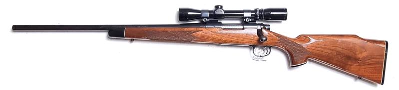 Buy 243 Remington 700 Blued Wood 22" Left Hand with 2-7x Scope in NZ New Zealand.